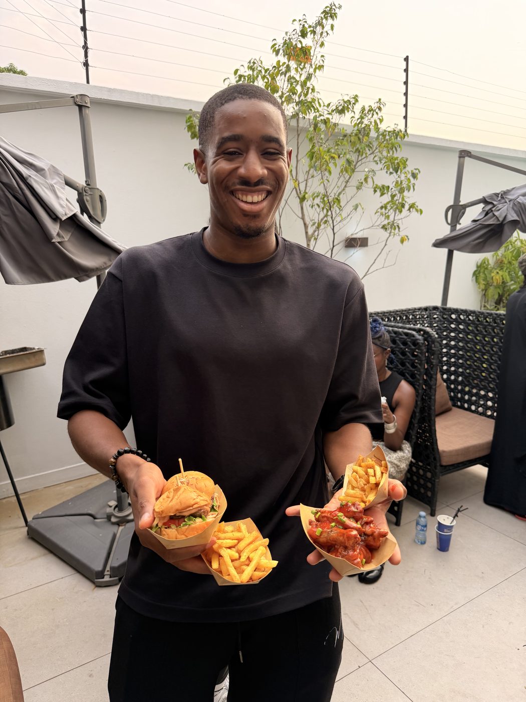 DaChef customer holding two food boxes at a pop-up
