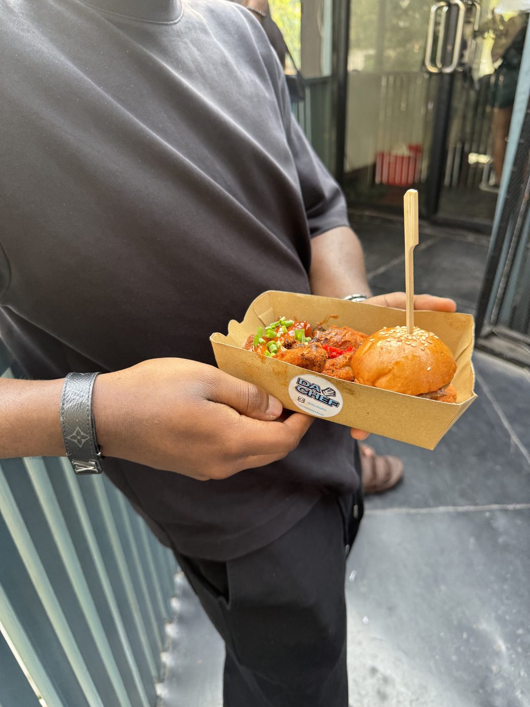 DaChef branded box with wings and burger at a pop-up