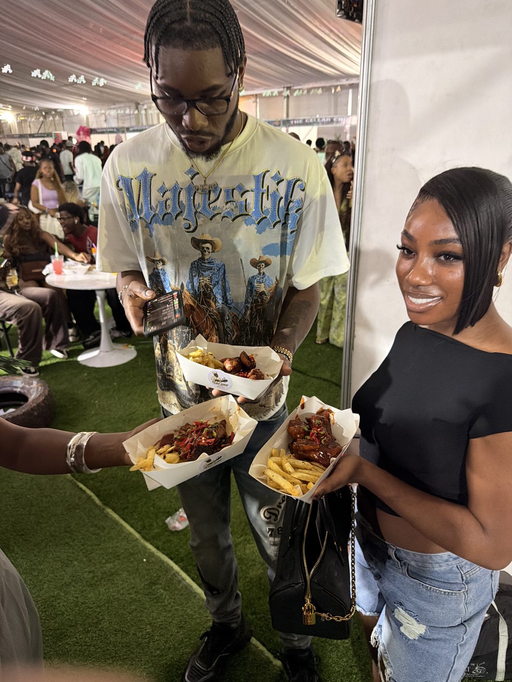 Customers at a DaChef pop-up holding food boxes